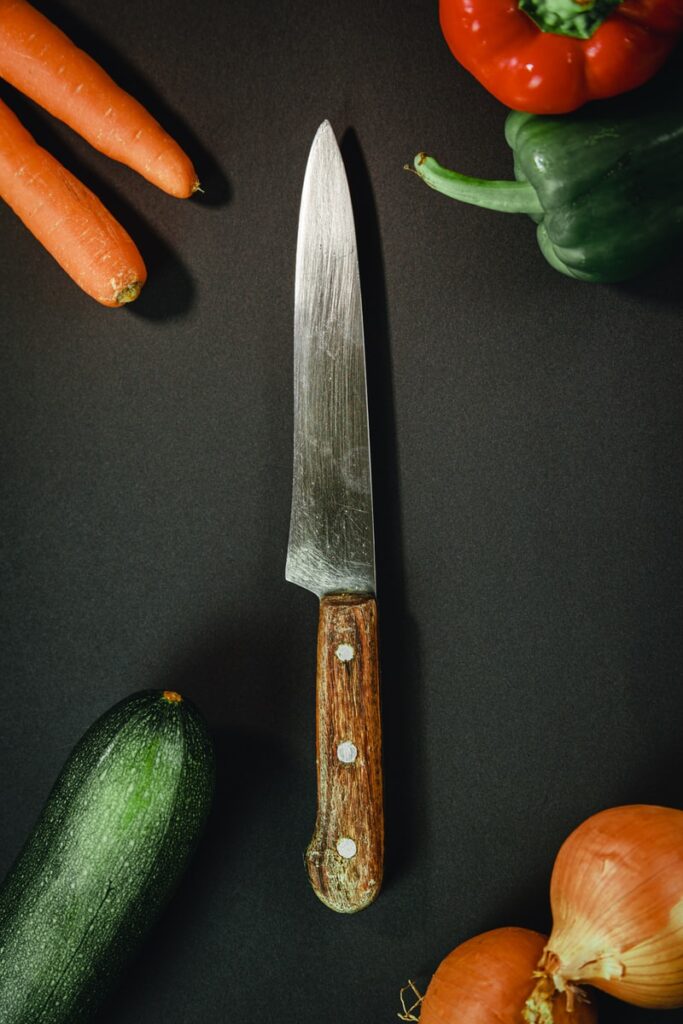 orange and silver kitchen knife